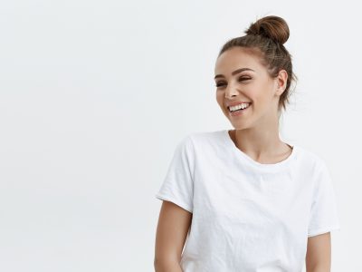 woman in white tee shirt smiling