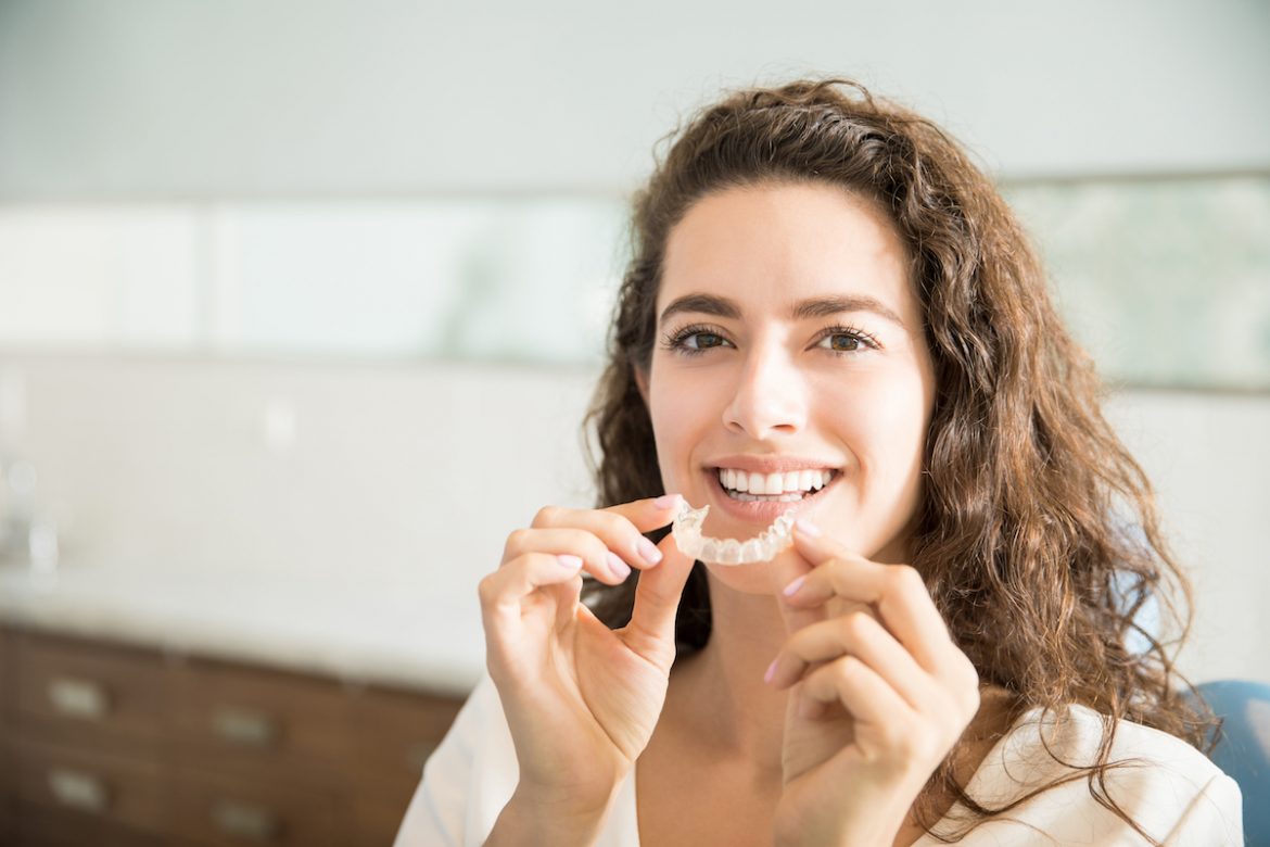 woman using invisilign