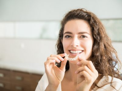 woman using invisilign